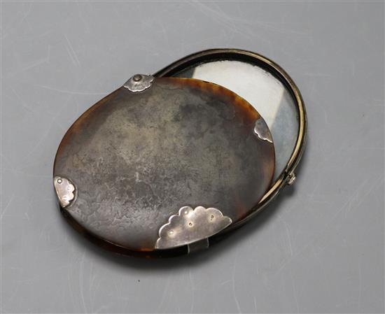 A tortoiseshell and white metal mounted magnifying glass, 95mm.